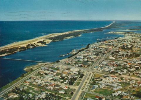 Aerial view of Lakes Entrance Township and Ninety Mile Beach, 1974