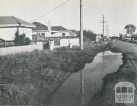 An unsewered area, where street channels are used to dispose of kitchen and laundry wastes, Melbourne, 1955