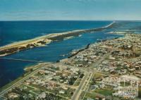 Aerial view of Lakes Entrance Township and Ninety Mile Beach, 1974