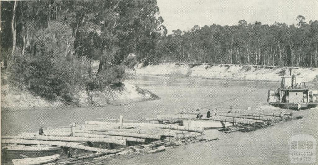 Logs chained to the outriggers on a barge 'train', Echuca, 1950