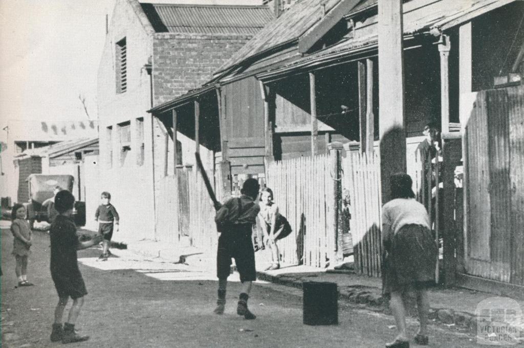 The childrens playground, a slum street, Richmond, 1942